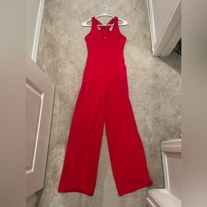 Red pants jumpsuit. Worn once. Size small. Excellent condition